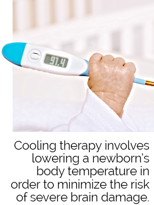 newborn holding thermometer