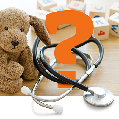 stuffed toy puppy, stethoscope and large orange question mark